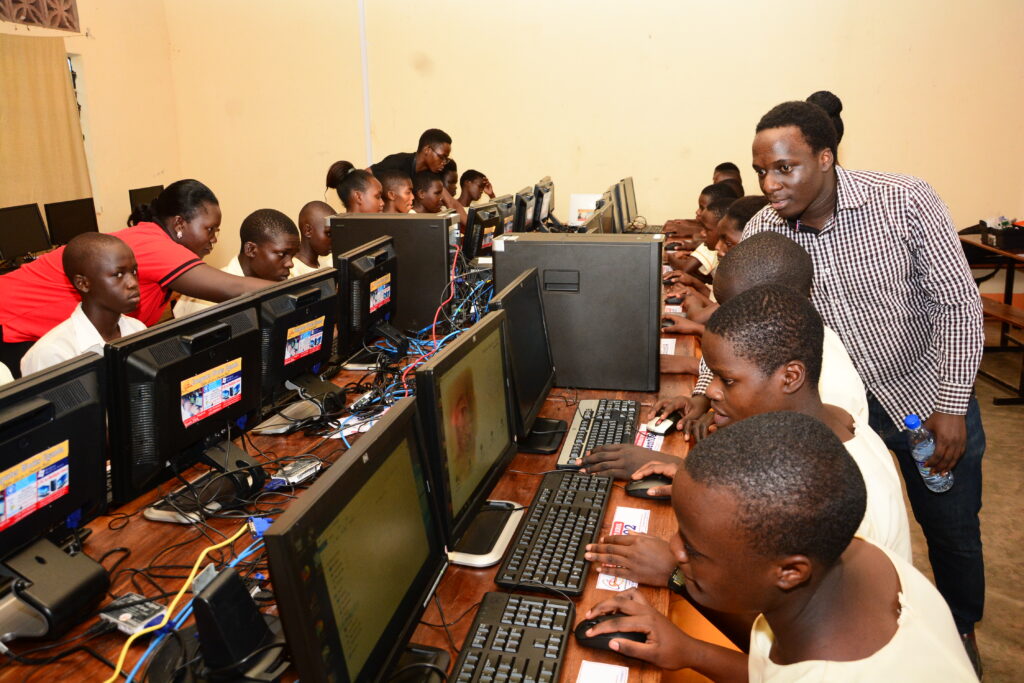 Students learning in the Buddo Christian Secondary School computer lab donated by Computer Works Uganda