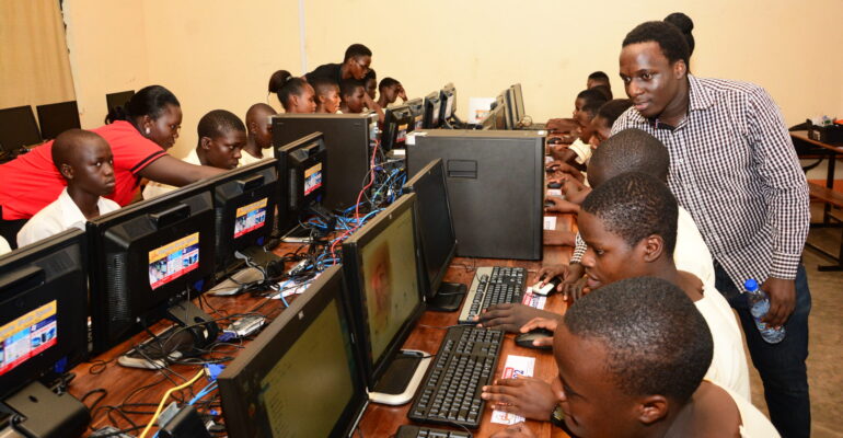 Students learning in the Buddo Christian Secondary School computer lab donated by Computer Works Uganda