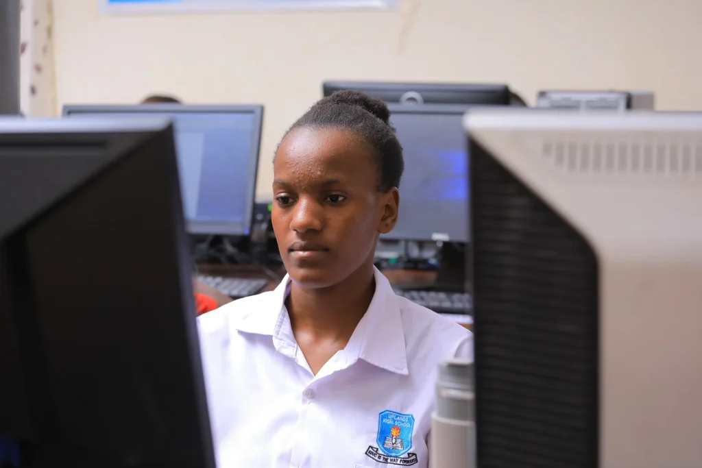 Female student learning ICT in a school computer lab