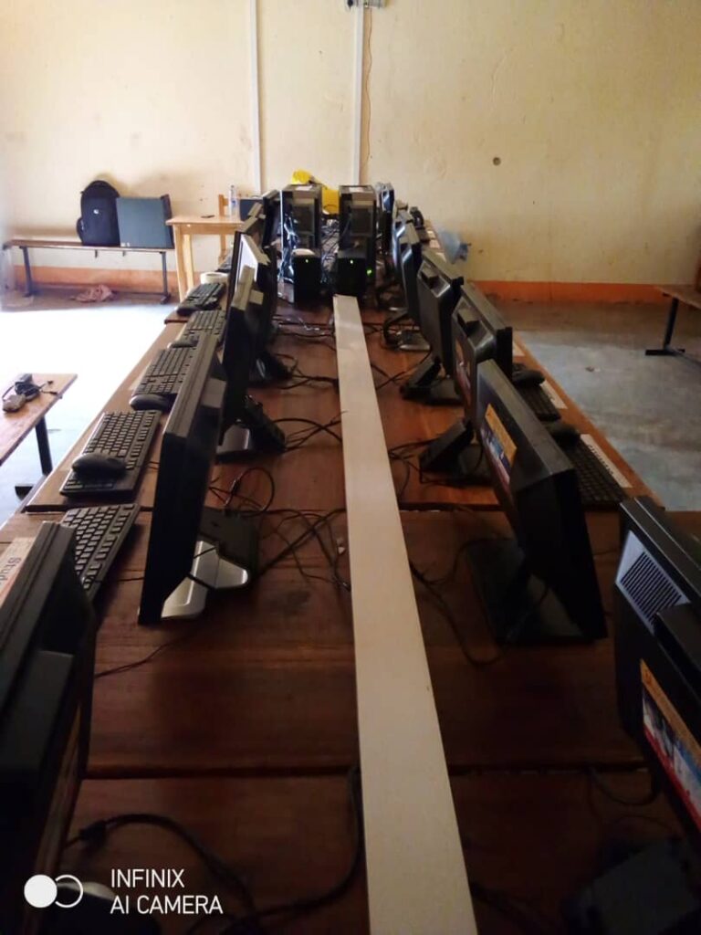Rows of computer stations in an inclusive school computer lab installed by Computer Works Uganda